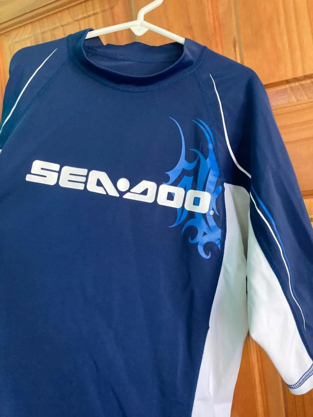Boy’s size 12/14 Sea-Doo navy blue and white short sleeved swim shirt/rash guard